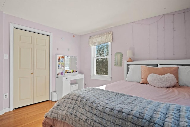 bedroom featuring a closet and light wood-type flooring