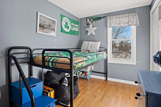 bedroom with wood-type flooring