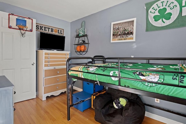 bedroom with wood-type flooring