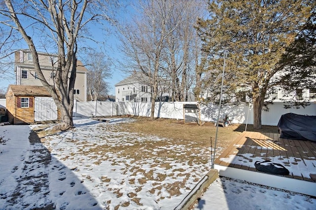 yard covered in snow featuring a wooden deck