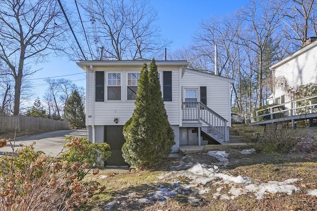 view of front of house with fence