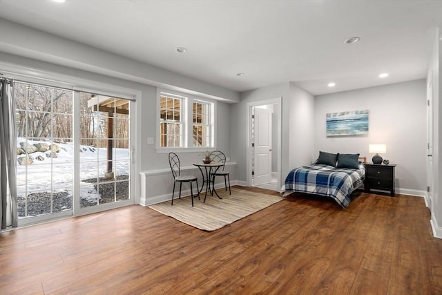 bedroom with access to exterior, recessed lighting, baseboards, and wood finished floors