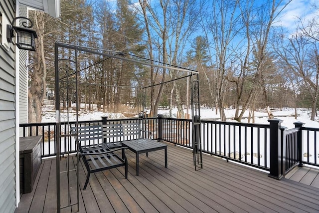 view of snow covered deck