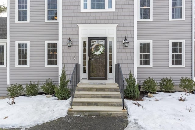 view of snow covered property entrance