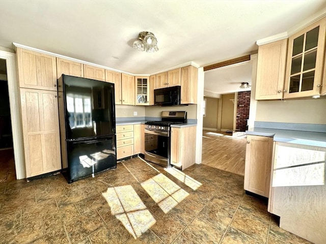 kitchen featuring black appliances and light brown cabinetry