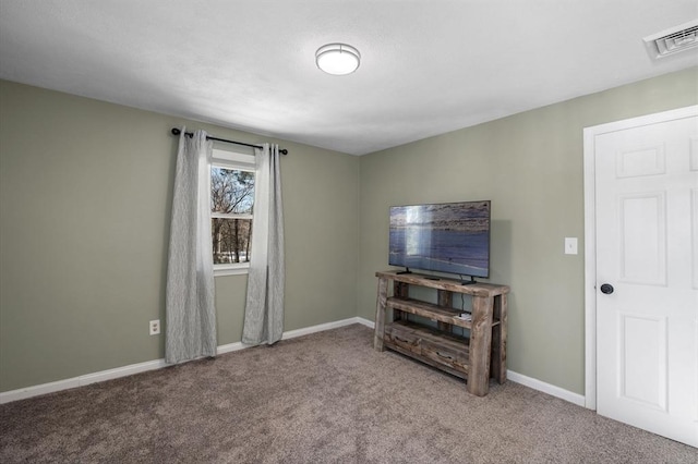 carpeted living room featuring visible vents and baseboards