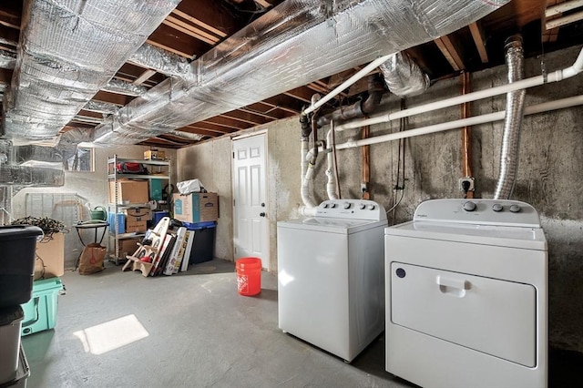 unfinished below grade area featuring separate washer and dryer