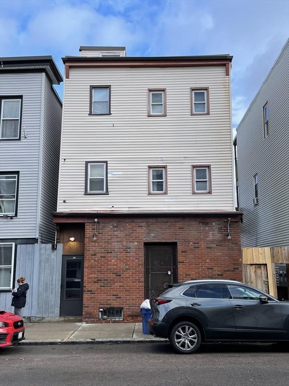 view of front of home with brick siding