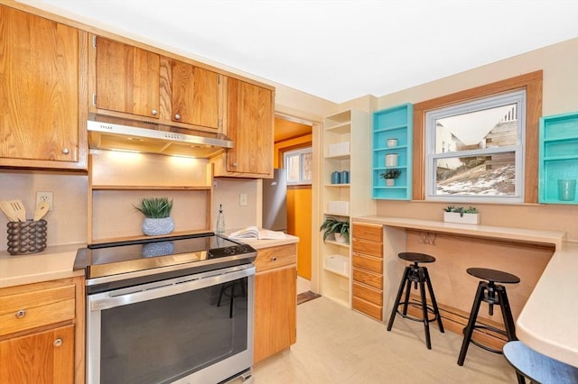 kitchen with stainless steel range with electric cooktop