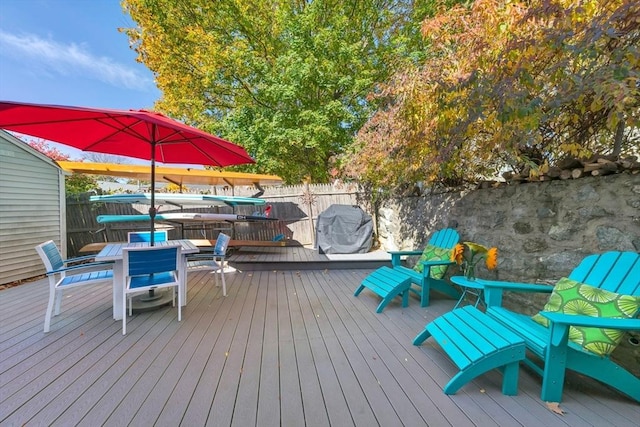 deck featuring a hot tub