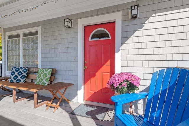 doorway to property featuring covered porch