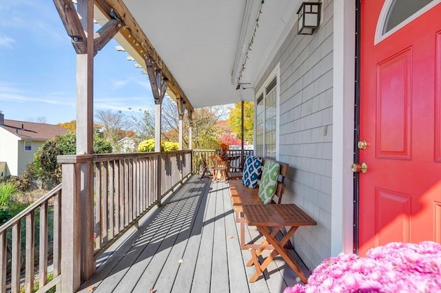 wooden terrace featuring a porch