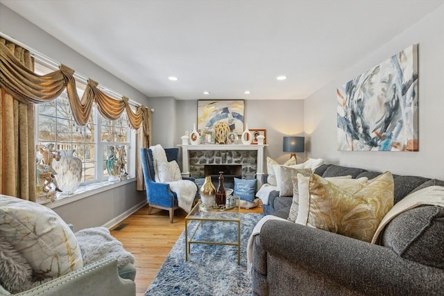105 Cross St, Randolph, MA 02368 - living room featuring a fireplace and light hardwood / wood-style flooring