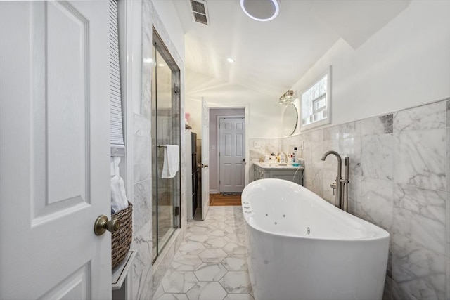 105 Cross St, Randolph, MA 02368 - bathroom with vanity, separate shower and tub, and tile walls