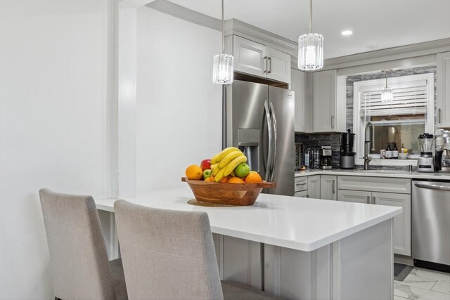 105 Cross St, Randolph, MA 02368 - kitchen with a kitchen bar, sink, gray cabinetry, tasteful backsplash, and appliances with stainless steel finishes