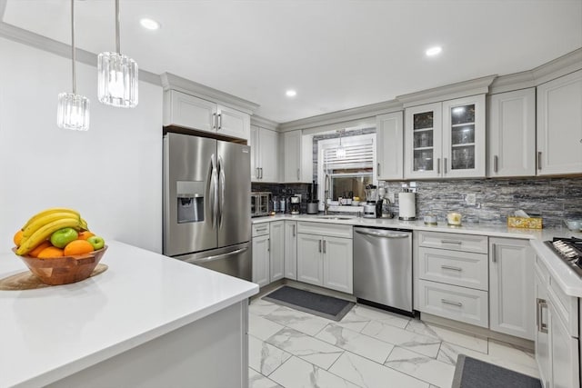 105 Cross St, Randolph, MA 02368 - kitchen with appliances with stainless steel finishes, sink, hanging light fixtures, and decorative backsplash