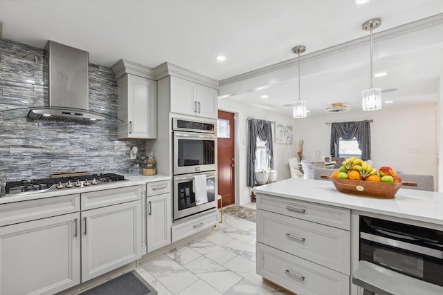105 Cross St, Randolph, MA 02368 - kitchen with wall chimney range hood, appliances with stainless steel finishes, backsplash, a wealth of natural light, and decorative light fixtures