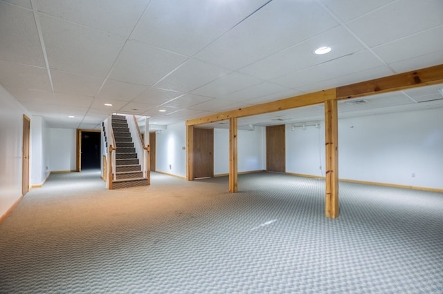 basement with carpet and a drop ceiling