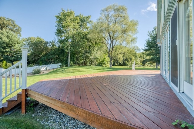 wooden deck with a lawn