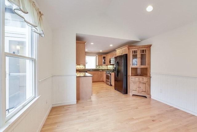 11 Dillingham Way Unit 11, Plymouth, MA 02360 - kitchen with appliances with stainless steel finishes, light wood finished floors, glass insert cabinets, a wainscoted wall, and recessed lighting