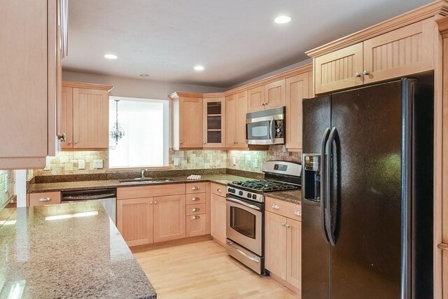 11 Dillingham Way Unit 11, Plymouth, MA 02360 - kitchen with stainless steel appliances, light brown cabinetry, a sink, tasteful backsplash, and recessed lighting