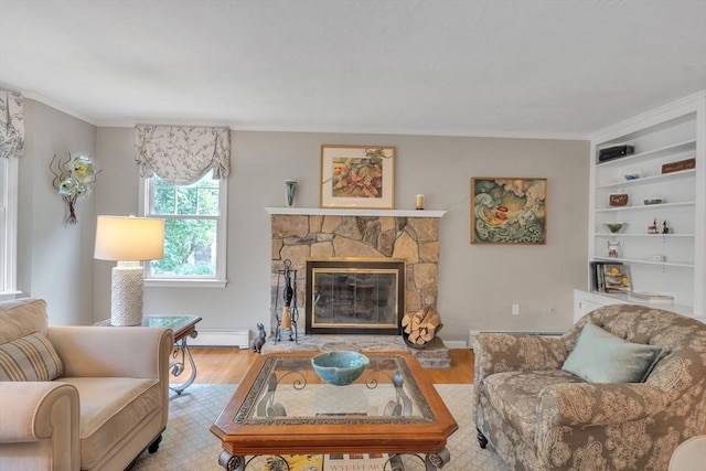 121 Merriam Rd, Grafton, MA 01519 - living room featuring wood finished floors, a baseboard heating unit, ornamental molding, built in shelves, and a fireplace