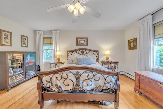 121 Merriam Rd, Grafton, MA 01519 - bedroom with light wood-style floors, a ceiling fan, and a baseboard heating unit