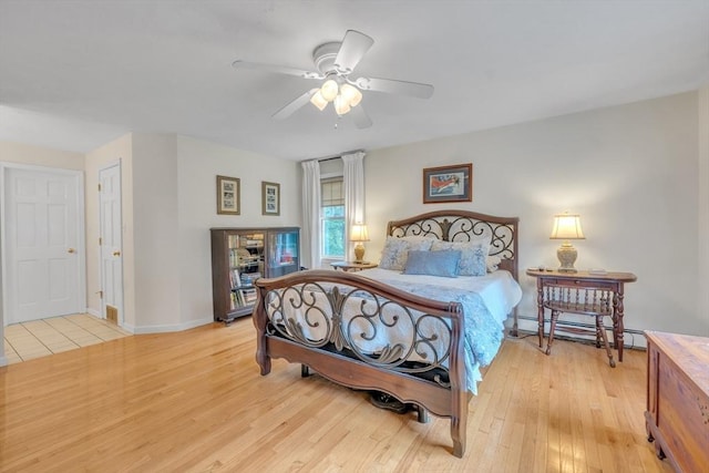 121 Merriam Rd, Grafton, MA 01519 - bedroom featuring baseboard heating, light wood-type flooring, and ceiling fan