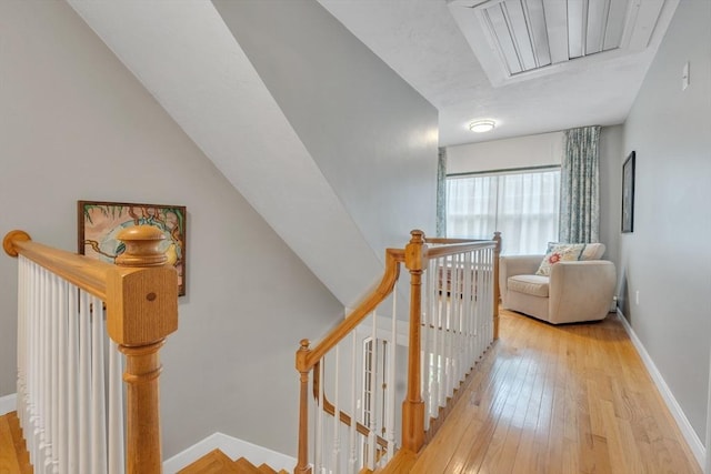 121 Merriam Rd, Grafton, MA 01519 - hallway with an upstairs landing, attic access, and wood-type flooring