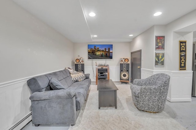 121 Merriam Rd, Grafton, MA 01519 - living room with a baseboard heating unit, a decorative wall, recessed lighting, and a wainscoted wall