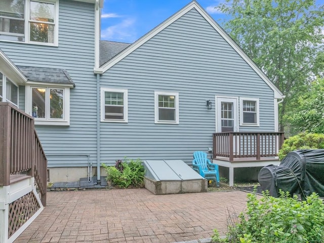 121 Merriam Rd, Grafton, MA 01519 - back of property featuring a shingled roof, a patio, and a wooden deck