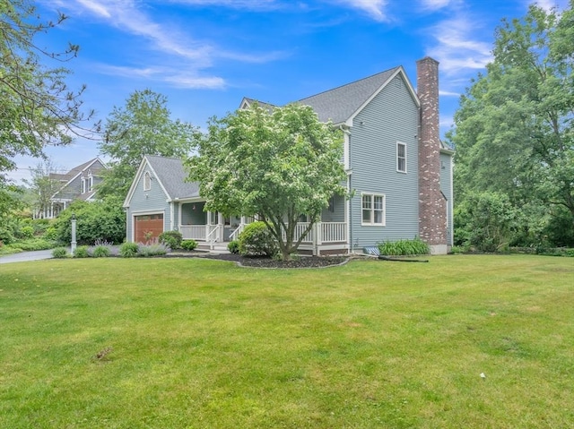 121 Merriam Rd, Grafton, MA 01519 - view of front of property with a porch, a chimney, a front yard, and an attached garage