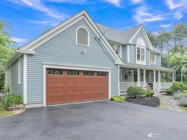 121 Merriam Rd, Grafton, MA 01519 - view of front facade with covered porch, driveway, and an attached garage