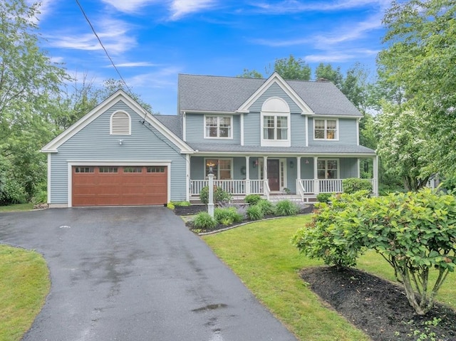 121 Merriam Rd, Grafton, MA 01519 - view of front of house with a garage, asphalt driveway, a porch, and a front lawn