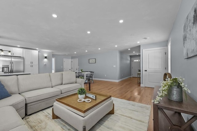 living room with light hardwood / wood-style flooring