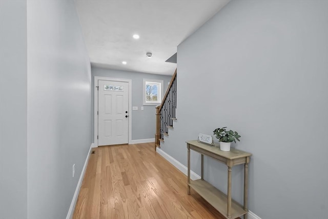 foyer entrance with light hardwood / wood-style flooring