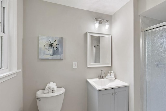 full bath featuring a shower stall, toilet, and vanity