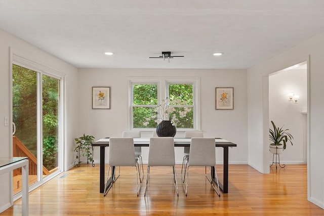 dining area featuring light wood-style flooring, recessed lighting, and baseboards