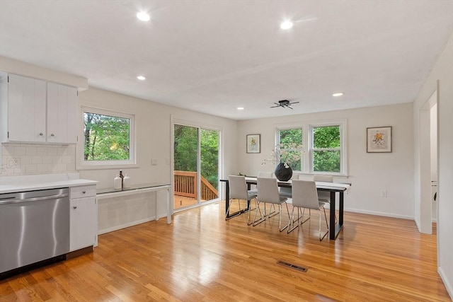 dining area featuring light wood-style flooring, recessed lighting, and baseboards