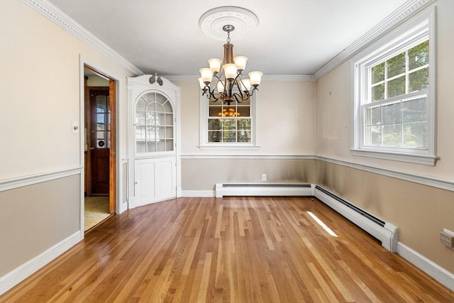 29 Gregory Rd, Wakefield, MA 01880 - unfurnished dining area featuring a chandelier, light wood-type flooring, ornamental molding, a baseboard radiator, and baseboard heating