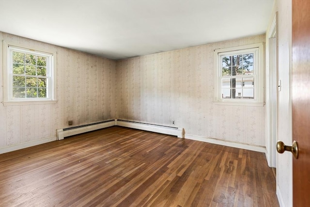 29 Gregory Rd, Wakefield, MA 01880 - empty room with wood finished floors, baseboard heating, healthy amount of natural light, and wallpapered walls