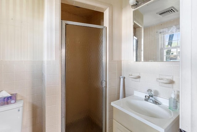 29 Gregory Rd, Wakefield, MA 01880 - bathroom with tile walls, vanity, and a stall shower