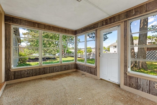 29 Gregory Rd, Wakefield, MA 01880 - unfurnished sunroom with healthy amount of natural light, carpet floors, and wood walls