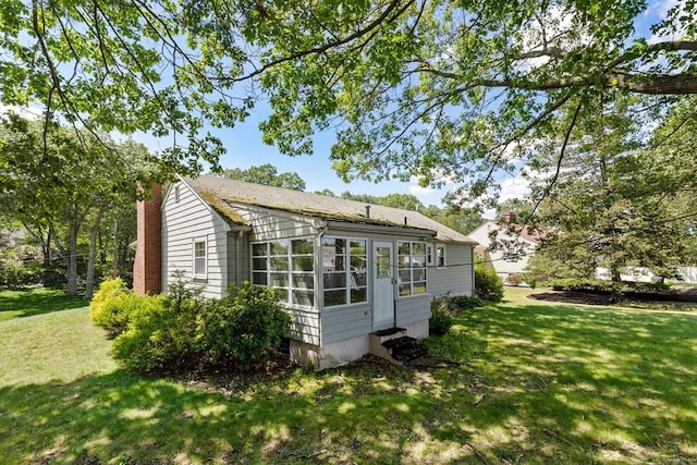 29 Gregory Rd, Wakefield, MA 01880 - view of side of property featuring entry steps and a lawn