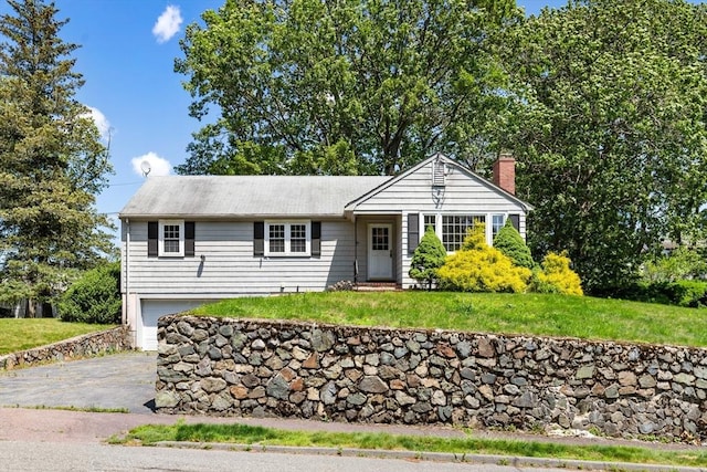 29 Gregory Rd, Wakefield, MA 01880 - single story home featuring a chimney, a garage, driveway, and a front yard