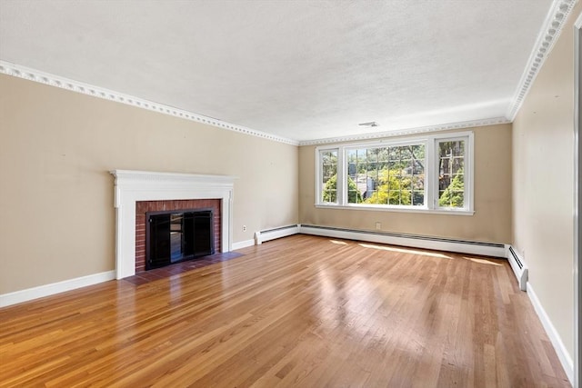 29 Gregory Rd, Wakefield, MA 01880 - unfurnished living room featuring light wood-style floors, a brick fireplace, ornamental molding, and baseboard heating