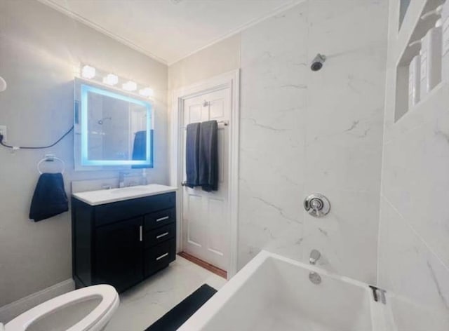 full bathroom featuring vanity, tiled shower / bath, and toilet