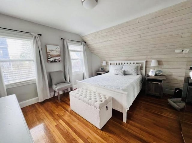 bedroom with hardwood / wood-style flooring and vaulted ceiling