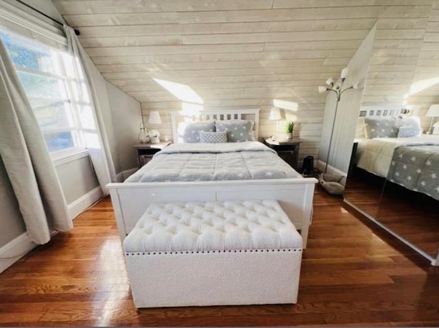 bedroom featuring wooden ceiling, vaulted ceiling, and hardwood / wood-style floors