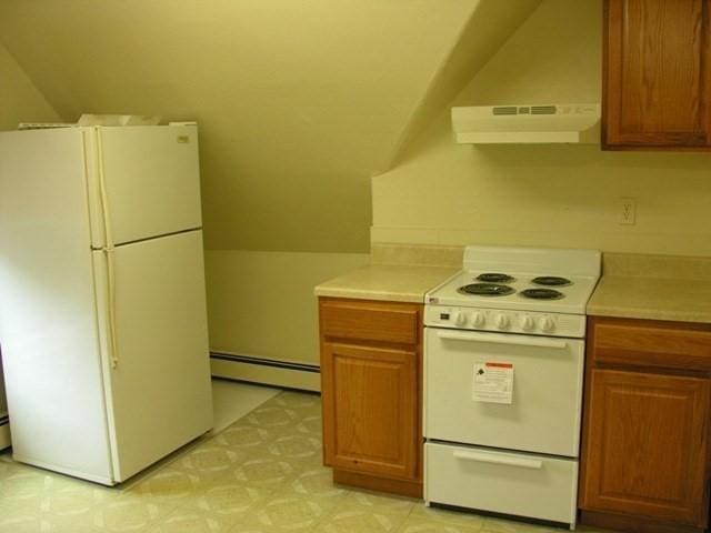 kitchen featuring a baseboard radiator, white appliances, light countertops, and range hood